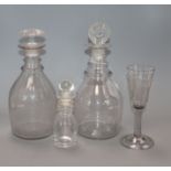 An early 19th century ale glass, two ring neck decanters and an oil jar tallest 26cm