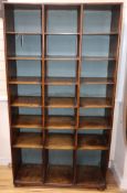 A stained beech open fronted pigeon hole cabinet, with 21 divisions W.92cm