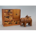 A Chinese carved elephant inkstand and a parquetry table cabinet tallest 19.5cm