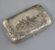 A late 19th century Russian 84 zolotnik silver and niello cigarette case, decorated with scene of