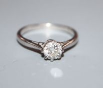 A platinum and solitaire diamond ring, the stone weighing approximately 0.6cts, size N.