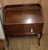 An Edwards and Roberts marquetry inlaid mahogany bureau W.89cm