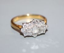 A modern diamond and 18ct gold cluster ring, size N.