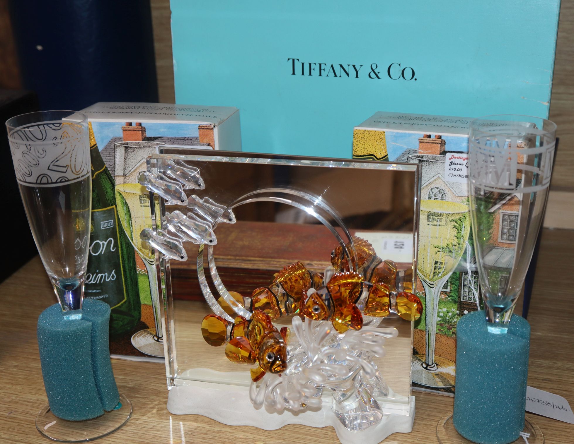 Tiffany glasses, a Swarovski ornament and a pair of Dartington glasses