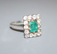 A white metal, emerald and white sapphire? set rectangular cluster ring, size L.