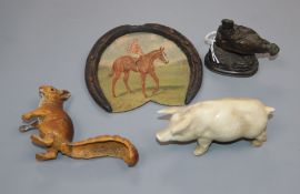 'A Cain', a small bronze cockerel, a pottery pig, a horseshoe trophy and a spelter squirrel