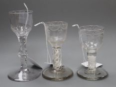 An 18th century cordial glass with bucket bowl and facet stem and two firing glasses, each with