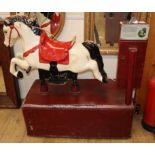 An electric coin operated painted wooden rocking horse L.102cm