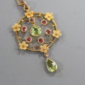 A peridot and amethyst openwork gold pendant (tests as 14ct) on fine chain, pendant 4cm. pendant