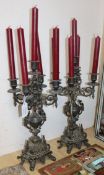 A pair of Victorian cast spelter four branch five light candelabra