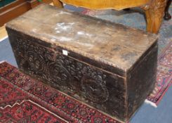 A 17th century Scandinavian chest, the front chip carved with rosettes W.104cm