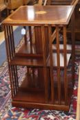 An Edwardian style inlaid mahogany revolving bookcase W.49cm