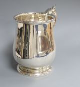 A Georgian style silver mug, Birmingham 1934, Mappin & Webb, of baluster form with acanthus-