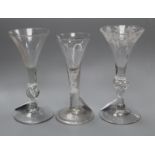 Three 18th century drinking glasses, various, comprising one with vineous-engraved trumpet bowl on