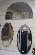 Three frameless wall mirrors largest 69cm wide