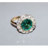 An 18ct, green garnet topped doublet and diamond cluster ring, size L.