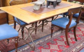 An extending conservatory table, with slatted cherrywood top over a Spanish style wrought iron