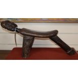 A carved tribal double headed stool