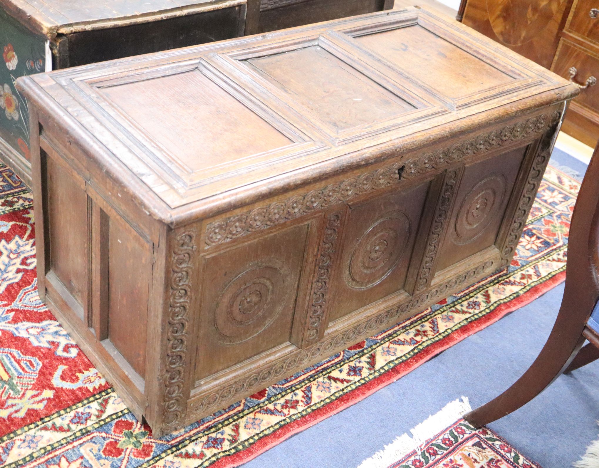 A 17th century oak panelled coffer (cut down) W.110cm