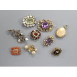 Two early 20th century amethyst brooches, five other brooches including Victorian garnet and