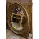 An Edwardian gilt oval wall mirror H.106cm