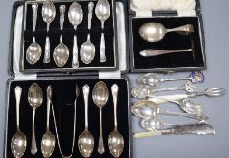 Two cased sets of silver teaspoons including one with tongs, a silver spoon & pushers and small