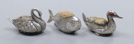 Three assorted novelty silver pin cushions, duck with glass eyes, Crisford & Norris, Birmingham,