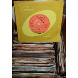 A collection of 1950's and later 45rpm vinyl single records, including Beatles, T-Rex, etc.