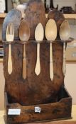 An 18th century fruitwood spook rack with turned carved spoons and fork