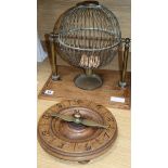 A late 19th century/early 20th century brass tombola cage and an early roulette wheel