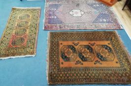 Two Turkish rugs and a Caucasian style blue ground rug largest 180 x 122cm