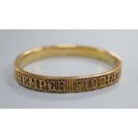 A yellow metal hinged bangle, inscribed 'Semper Fidelis'.