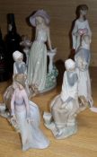 A Lladro girl with a straw hat, girl with a heart, two seated pheasant girls, girl with lamb and
