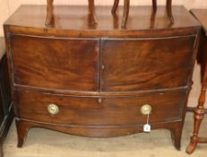 A 19th century bowfront mahogany cabinet W.107cm