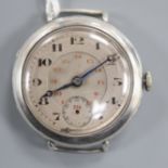 A gentleman's early 20th century white metal Omega manual wind wrist watch, with Arabic dial and