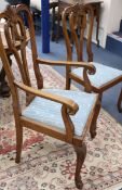 A set of six 18th century style oak dining chairs, on carved cabriole legs (two with arms)