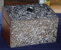 An Edwadian silver-mounted and leather-covered stationery box, decorated with pierced floral and