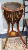 Two similar Edwardian style mahogany and satinwood-inlaid jardinieres, having circular brass bowls