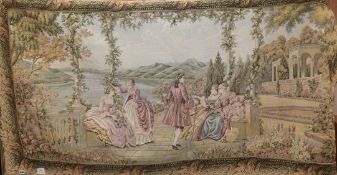 A Hines of Oxford machine made tapestry hanging depicting figures in a romantic lakeside setting 180
