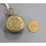 An Edward VII 1902 gold half sovereign and a base metal sovereign case.