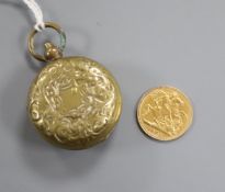 An Edward VII 1902 gold half sovereign and a base metal sovereign case.