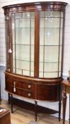 An Edwardian inlaid mahogany bow fronted display cabinet W.130cm