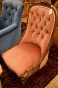 A pink Victorian rosewood nursing chair