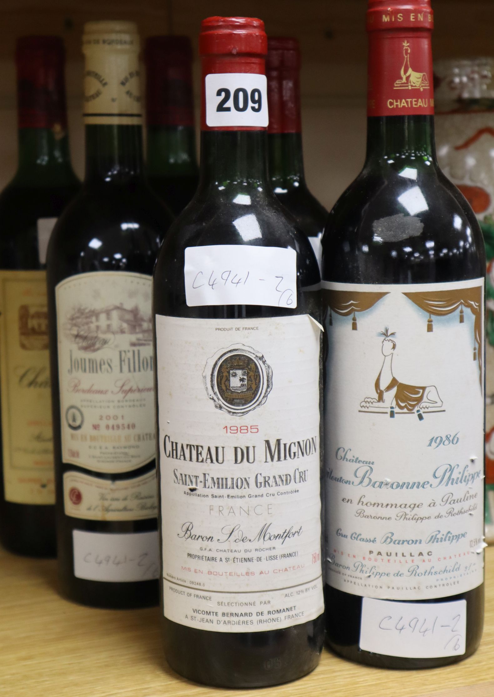 Six assorted clarets including Chateau du Mignon, 1985 and Chateau Benet (1983) (2)