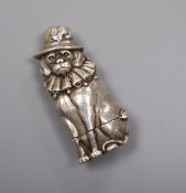 A novelty white metal vesta case, modelled as a seated dog wearing a hat, the interior stamped '