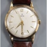 A gentleman's 1960's 9ct gold Tudor manual wind wrist watch, with later associated leather strap.