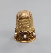 A late Victorian 15ct gold and seed pearl set thimble, with cannetile work decoration, James Fenton,