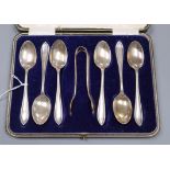 A cased set of six silver teaspoons and tongs.