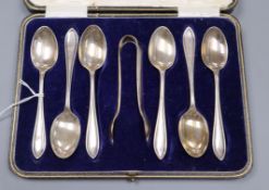 A cased set of six silver teaspoons and tongs.