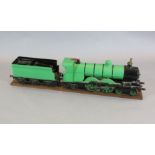 A 3.5 inch gauge 4-4-2 live steam locomotive and tender on wood stand, loco 27in. tender 18in.